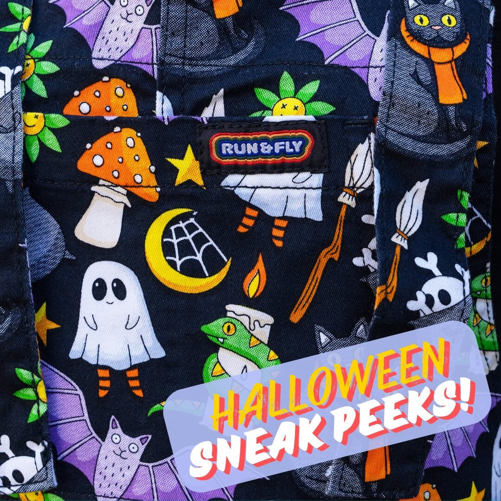 Close-up of spooky-themed fabric featuring black cats, ghosts, mushrooms, and other Halloween motifs. Perfect preview of Run & Fly’s ethical slow fashion collection.